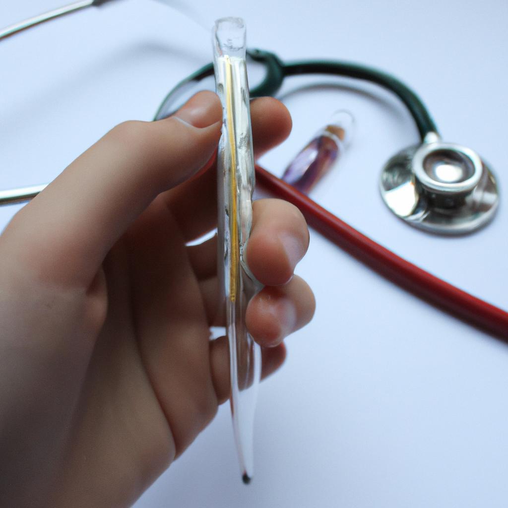 Person holding thermometer and stethoscope